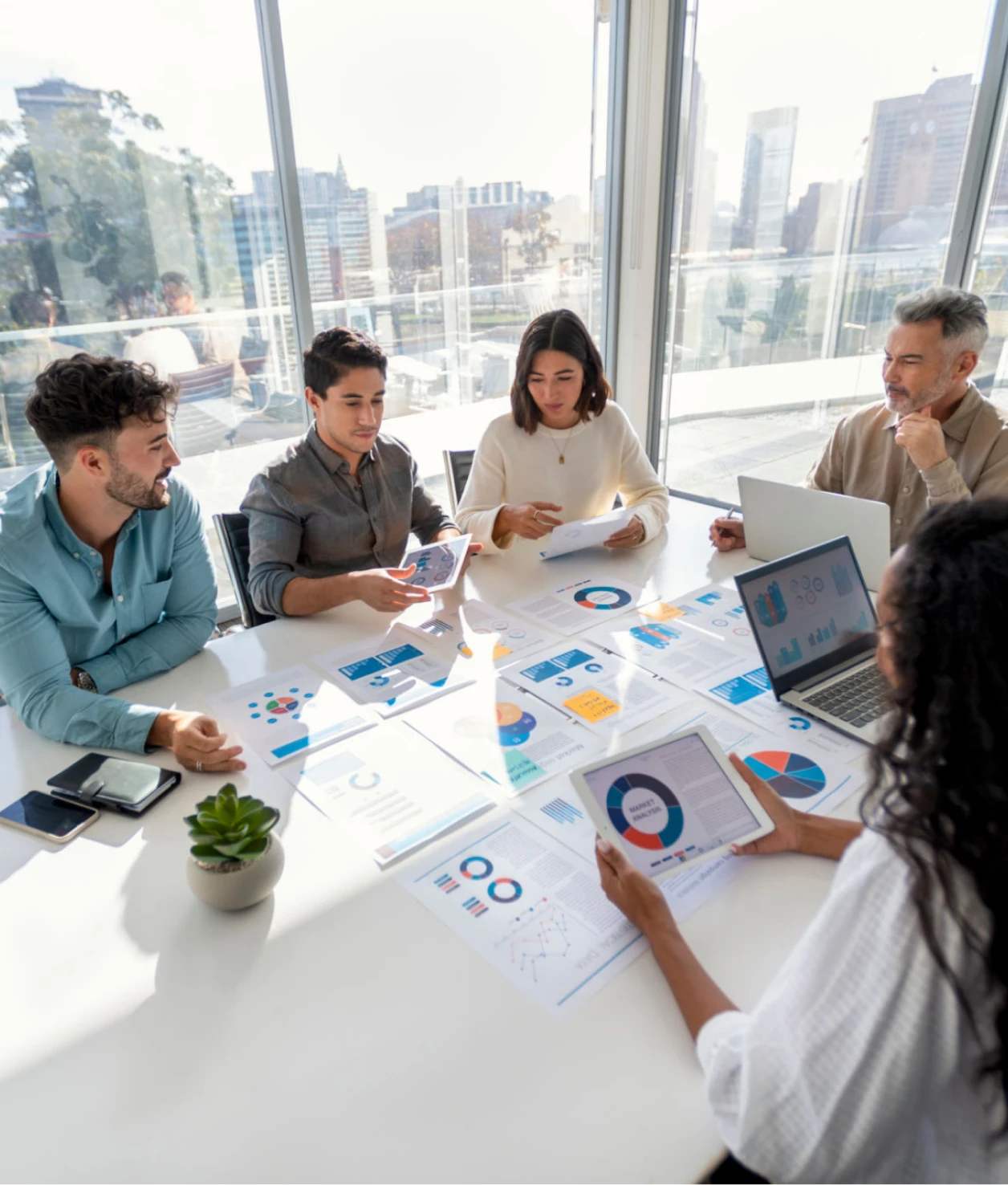 Office meeting with data analysis discussion